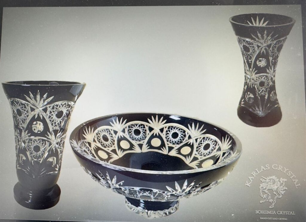 Black cut crystal vases and bowl with white star patterns