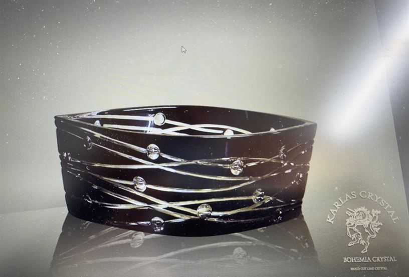 Black glass bowl with modern wavy line patterns