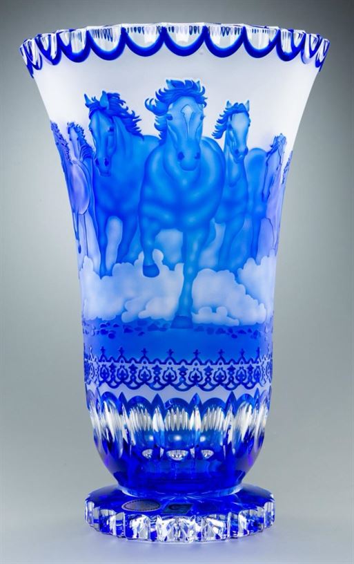 Blue crystal vase with horses running through clouds